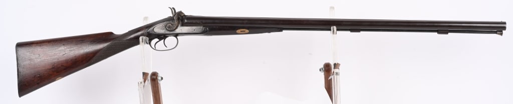 W&C SCOTT DOUBLE BARREL PERCUSSION SXS SHOTGUN: BARRELS 30.5". GAUGE 12. Percussion, exposed hammers, double triggers, checkered straight grip walnut stock, smooth steel butt plate. Barrels are a deep blue brown smooth patina. Stock has repair at w