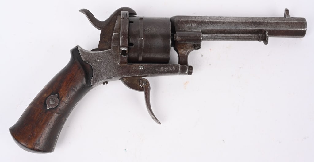 ANTIQUE BELGIUM PINFIRE POCKET REVOLVER: SERIAL 4781. BARREL 3.5". CALIBER 7MM. Five shot, double action, folding trigger, octagon barrel, wood grips. Condition. Smooth patina overall. Grips fine, cylinder does not advance. Bore is strong wi