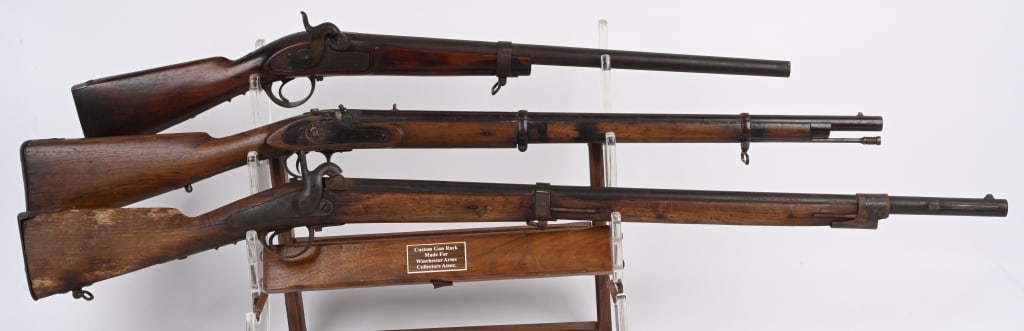 LOT (3) ANTIQUE MILITARY RIFLES FOR PARTS: A. Unmarked carbine with cut barrel & stock, no maker name. B. Lock stamped London, No hammer, 28" barrel has British proofs. two bands, .60 caliber. decent stock with some staining. C. Belgium Liege 
