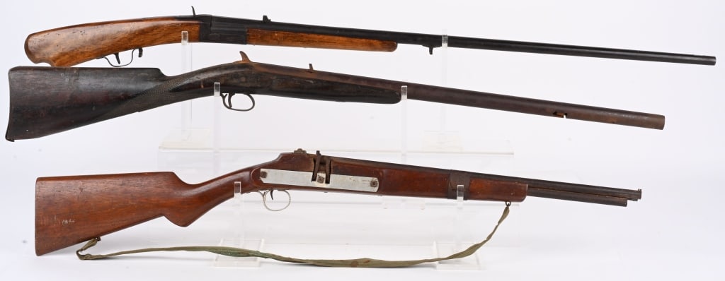 LOT (3) CURIOSA LONG ARMS: A. Shop made 4-barrel rifle. Bore measures .30. Walnut stock. Have no idea how this gun was supposed to work. Metal has coat of rust. ??? B. SINGLE SHOT 12 BORE. Barrel has weird loading port cut on r