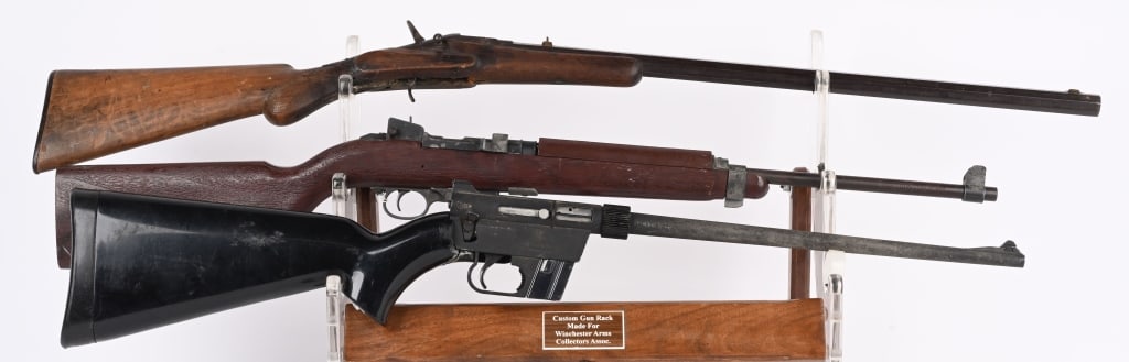 LOT (3) PARTS DECORATOR GUNS: A. FAUX M-1 CARBINE. NON FIRING. B. AR7 EXPLORER .22. SERIAL NSN. Stock shattered, metal has light coating or surface rust, appears complete with good magazine and butt cap. C. FLOBERT PARTS RIFLE. No