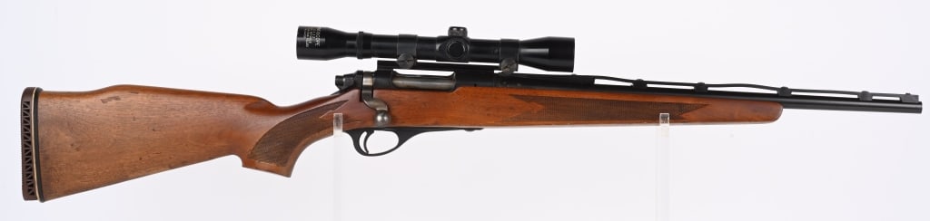 REMINGTON MODEL 600 CARBINE: SERIAL 11240. CALIBER 6MM REM. BARREL 18.5". Features vinyl vent rib, blue finish, press checkered hardwood stock, added recoil pad (not fitted) with 4x32 scope. Condition. 95% blue with few scattered