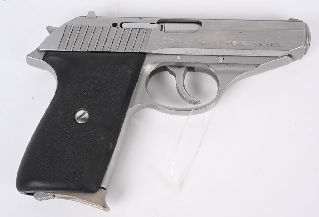 SIG SAUER P230SL SEMI AUTO PISTOL: SERIAL S053078. BARREL 3.5". CALIBER 9MM KURZ. Stainless double action, rubber grips, one (7) round magazine, red dot combat sights. Condition. Usual minor handling marks. near mint bore, fine grips. 