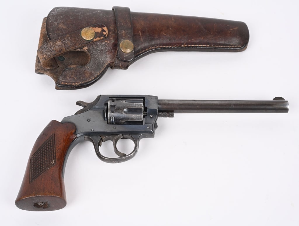IVER JOHNSON TARGET SEALED 8 REVOLVER: SERIAL M75039. BARREL 6". CALIBER 22RF. MADE 1947-54. Double action, 8-shot, blue finish, checkered walnut grips. Condition. 90% blue on frame, barrel is smooth patina. Legends are crisp. Grips are ex