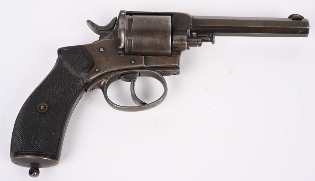 BELGIUM DOUBLE ACTION REVOLVER: SERIAL 2482. BARREL 4 1/4". CALIBER 9MM. Typical early 20th century double action, octagon barrel, 6-shot, checkered gutta percha grips. Condition. Left grip has chip while right has a repaired crack.