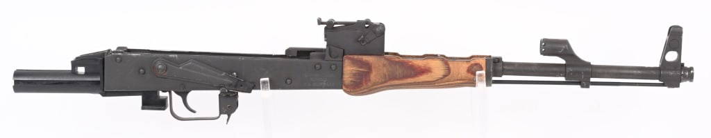 ROMANIAN GP/WASR-10/63 BARRELD ACTION: SERIAL NUMBER: 1988-ACT2694. BARREL: 16-1/2". CALIBER: 7.62X39. MANUFACTURED: 2000S. Made by Cugir and imported by CAI. Comes as pictured, with no stock, top hand guard, gas tube, bolt, carrier, recoi