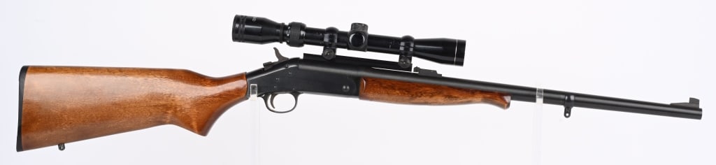NEW ENGLAND ARMS SB2 .22 HORNET SINGLE SHOT RIFLE: SERIAL NF230544. BARREL 22". CALIBER 22 HORNET. Top break, blue finish, pistol grip hardwood stock, Tasco 3x9 scope, sling eyes, front sight but no rear. Condition. 99% blue with light handling. Wood 