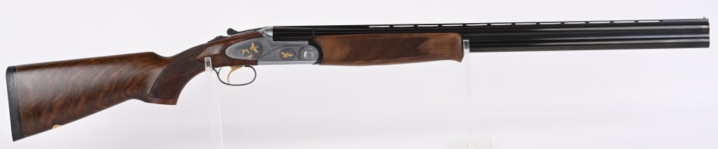 ENGRAVED ITALIAN VERONA LX692 O/U SHOTGUN: SERIAL NUMBER: 135775. BARRELS: 28". CALIBER: 12 GAUGE. MANUFACTURED: 2000. Made in Italy and imported by ECC of Boulder City Nevada. Vent rib barrel, with brass bead front sight. Barrels are blued an