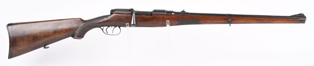 STEYR MANNLICHER SHOENAUER MOD, 1908 8X56 RIFLE: SERIAL NUMBER 8688 BARREL 20" CALIBER 8X56 MANUFACTURED CIRCA 1920'S. Full length walnut stock with checkered pistol grip and forearm with serrated steel butt plate with trap for cartridges. Marked on