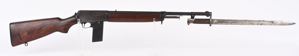 WINCHESTER MODEL 1907 SL WITH BAYONET 10RD MAG: SERIAL NUMBER: 50668. BARREL: 20". CALIBER: .351 SL. MANUFACTURED: 1950. Looks to be a possible police gun, but no police markings are visible. Standard markings on the barrel and tang. Winchester pro