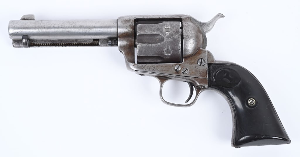 ANTIQUE COLT SAA REVOLVER: SERIAL 81251. BARREL 4 3/4". CALIBER .44-40. MADE IN 1882. A basic no finish early single action. The gutta percha grips are well worn but they are not the correct eagles. The ejector rod head and pin