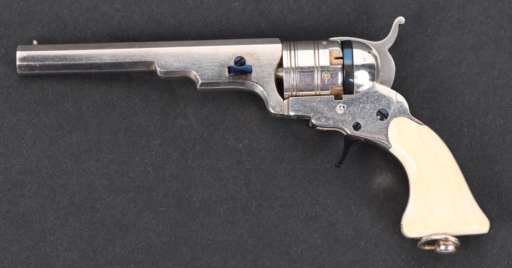MINATURE PATERSON REVOLVER BY LARRY SMITH: Made in a 1/3 scale by noted miniature maker Larry Smith, Colt's Paterson revolver with Silver plated with niter blue accents and ivory grips. The gun is fire able with miniature pinfire cartridges. A