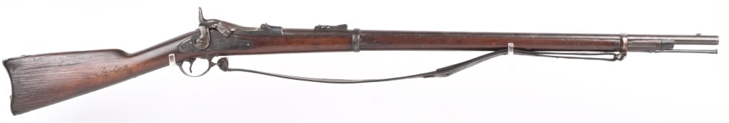 EARLY SPRINGFIELD MODEL 1873 TRAPDOOR .45-70: SERIAL NUMBER: 1245. BARREL: 32-1/2". CALIBER: .45-70. MANUFACTURED: 1873. Early style markings on the breech block. Lock plate has standard markings. Barrel is marked with "V/P/(eagles head)/P". Stan
