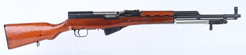 CHINESE NORINCO SKS SEMI AUTO RIFLE: SERIAL NUMBER: 20044865. BARREL: 20-1/2". CALIBER: 7.62X39. MANUFACTURED: 1980S/90S. Import marked on the barrel. Matching serials minus the 10 round magazine. Standard iron sights. Folding spike bayo