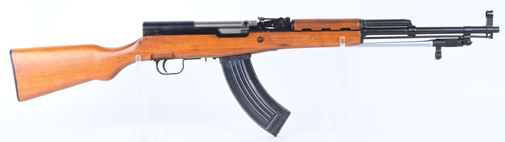 CHINESE NORINCO SKS SEMI AUTO RIFLE: SERIAL NUMBER: 1511295J. BARREL: 20-1/2". CALIBER: 7.62X39. MANUFACTURED: 1980S/90S. Import marked on the receiver. Matching serials throughout. Standard iron sights. This gun has a folding spike bayo