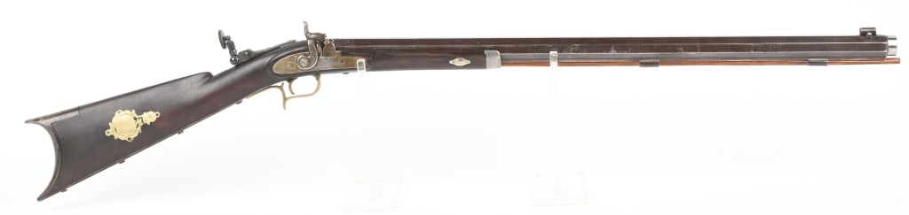 EARLY HALF STOCK PLAINS TARGET RIFLE: BARREL 28". CALIBER 44. Unmarked, heavy octagon barrel, percussion, half stock, single trigger, nice late 19th century adjustable tang sight, brass furniture with patch box. Muzzle is turned. Conditio