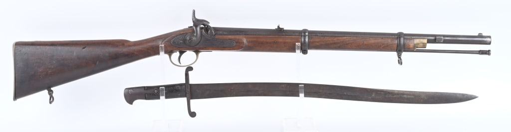 CONF, BRITISH MODEL 1861 TOWER ARTILLERY CARBINE: SERIAL NUMBER N/A BARREL 24" CALIBER .577 RIFLED MANUFACTURED 1861. Shortened version of the 1853 Enfield rifle with butt mounted sling swivel, 3 leaf folding rear sight graduated 1-2 & 300 yards. The