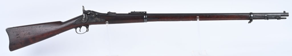 US SPRINGFIELD MODEL 1888 45-70 TRAPDOOR RIFLE: SERIAL NUMBER 531708 BARRE 32-5/8" CALIBER 45-70 GOV'T MANUFACTURED 1891. Full length oil finished walnut stock with rod bayonet. Buffington adjustable rear sight. Tilting breech marked US MODEL 1884.