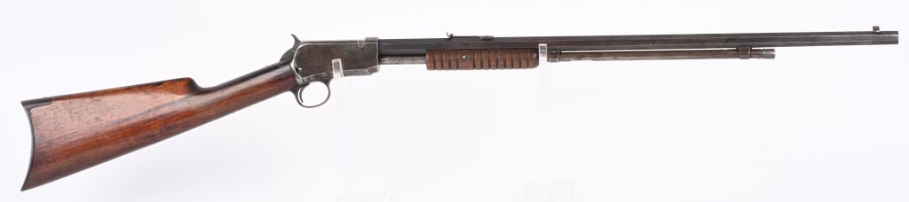 WINCHESTER 3RD MODEL 1890 22 SHORT PUMP RIFLE: SERIAL NUMBER 443017 BARREL 24" CALIBER 22 SHORT MANUFACTURED 1910. Octagon barrel with blue finish. Varnished walnut stocks with crescent butt plate. Chambered for 22 short. CONDITION, good with dark