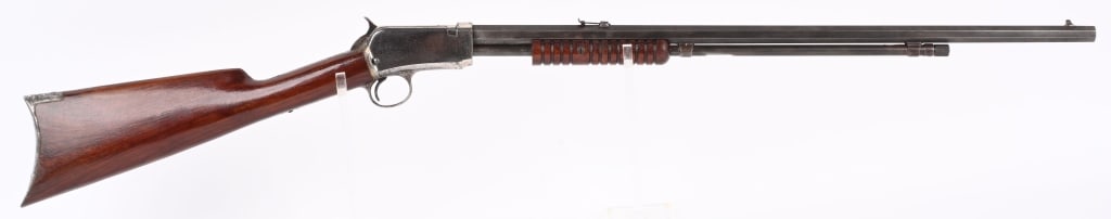 WINCHESTER 1/2 NICKEL 3RD MODEL 1890 22 SHORT PUMP: SERIAL NUMBER 496828 BARREL 24" CALIBER 22 SHORT MANUFACTURED 1912. Octagon barrel with tube magazine. Nickel finished receiver with varnished walnut stocks with crescent butt plate. Magazine tube has