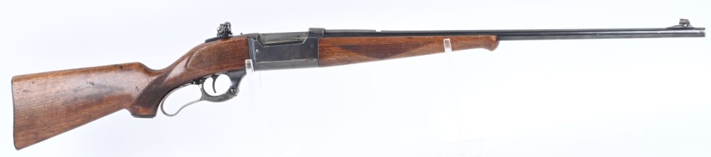 SAVAGE MODEL 99 LEVER ACTION RIFLE: SERIAL 554750. BARREL 24". CALIBER .300 SAVAGE MADE IN 1950. Standard solid frame, blue finish, checkered pistol grip walnut stock, case color lever. Rear sight blade removed with Redfield tang peep a