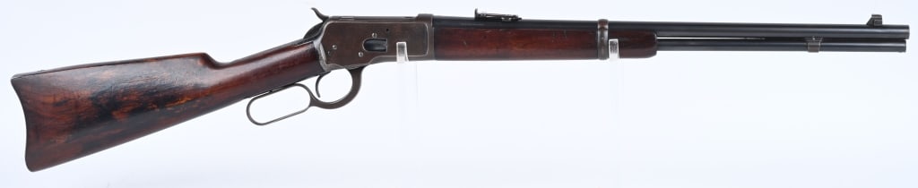 WINCHESTER MODEL 1892 SRC: SERIAL 963627. BARREL 20". CALIBER 25-20. MADE 1921-28. Full magazine, single barrel band, ladder rear sight, blue finish, gum wood stocks, carbine butt plate. Condition. Two mounting holes on left si