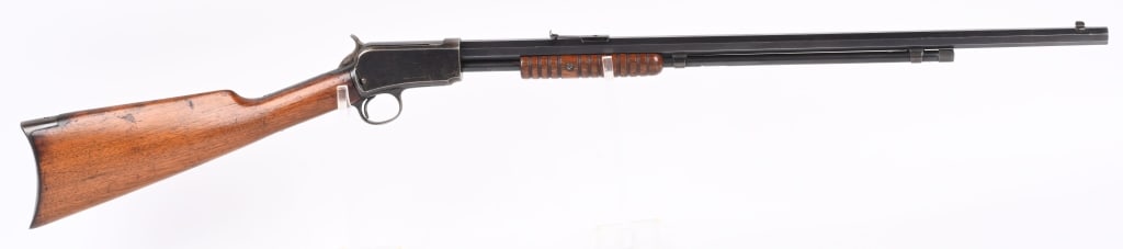 WINCHESTER 2ND MODEL 1890 PUMP 22 LONG RIFLE: SERIAL NUMBER 138845 BARREL 24" CALIBER .22 LONG MANUFACTURED 1902. Blue finished with octagon barrel , blade front sight and elevation adjustable rear sight. Varnished walnut stocks with crescent but