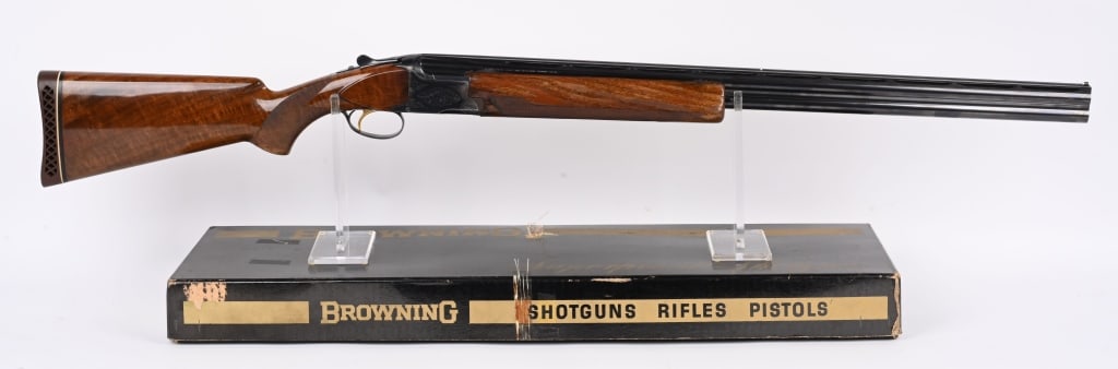 BOXED BELGIUM SUPERPOSED O/U 12 GA. SHOTGUN: SERIAL 9448 S69. BARRELS 30". GAUGE 12. CHAMBERS 2 3/4". CHOKES -FULL. LOP 14.5. MADE 1969 . Features blue finish, vent rib, gold trigger, deluxe checkered walnut stock & forearm, Browning pad. In ori