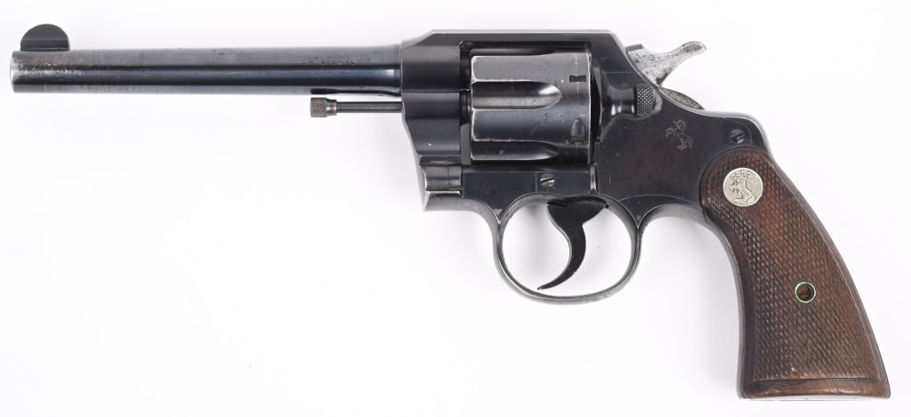 COLT ARMY SPECIAL .38 REVOLVER: SERIAL 537449. BARREL 6". CALIBER .38 SPL. MADE IN 1926. Standard blue finish, 6-shot double action, silver medallion checkered walnut grips. Condition. There is a bit of muzzle wear, some minor high 
