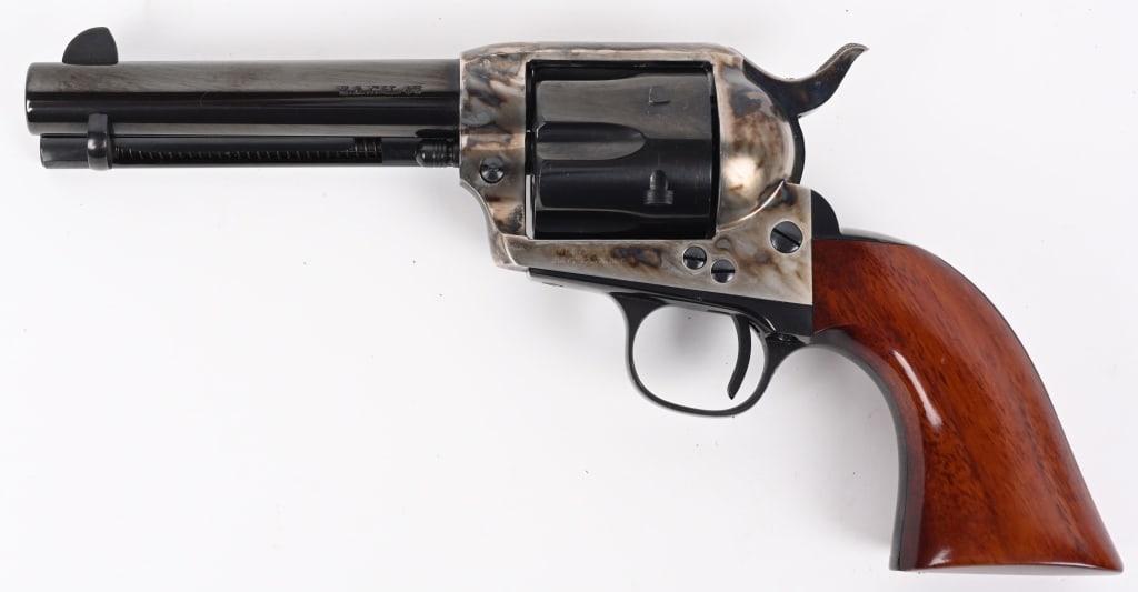 ITALIAN UBERTI MODEL 1873 SA REVOLVER .45 COLT: SERIAL NUMBER: 144700. BARREL: 4-3/4". CALIBER: .45 COLT. MANUFACTURED: 1997. Made in Italy. Standard markings and six shot fluted cylinder. Factory blued and case colored finishes. Oiled wood grip. C