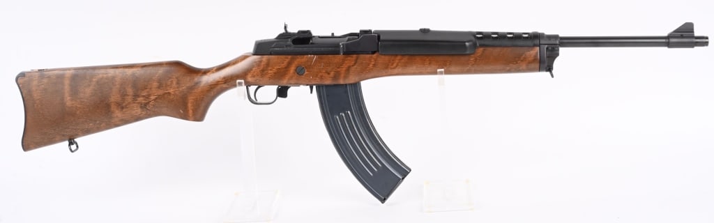 RUGER MINI-30 SEMI AUTO RIFLE IN 7.62X39: SERIAL NUMBER: 189-91231. BARREL: 18-1/2". CALIBER: 7.62X39. MANUFACTURED: 1999. Standard markings and features. Blade front sight and flip up rear. Original blued finish and oiled wood stock. Blued s