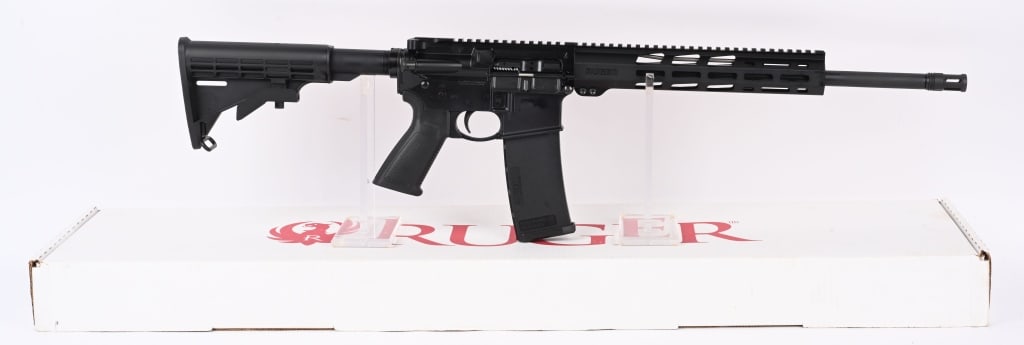 RUGER AR-556 SEMI AUTO RIFLE WITH BOX: SERIAL NUMBER: 1852-69449. BARREL: 16". CALIBER: 5.56X45MM. MANUFACTURED: 2022. Standard markings and features. Standard weight barrel with "1-8" twist rate. Full cage flash hider. Flat top upper and 