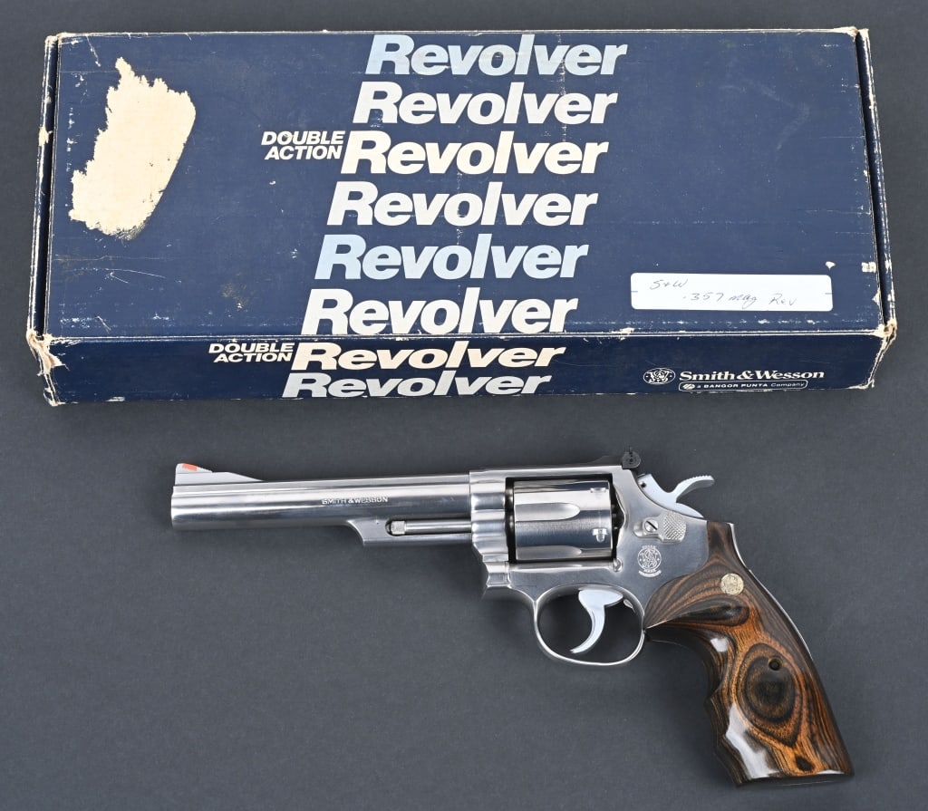 BOXED SMITH & WESSON MODEL 66-2 REVOLVER: SERIAL 101K436. BARREL 6". CALIBER .357 MAGNUM . Stainless steel, target rear sight, red insert front, wide target hammer & trigger. Exotic S&W finger groove grips. In matching number box. Condition. 