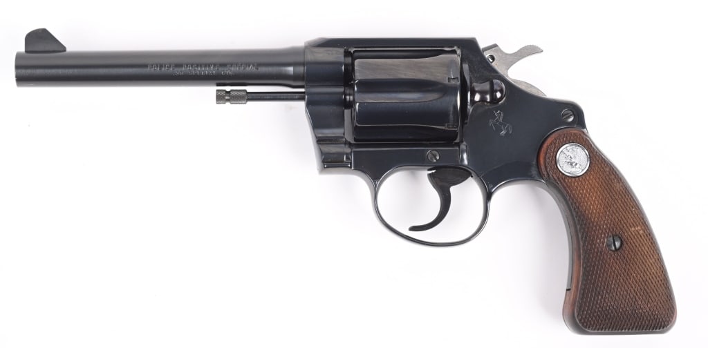 COLT RD BUTT POLICE POSITIVE SPECIAL .38 REVOLVER: SERIAL954917. BARREL 5". CALIBER 38 SPL. MADE IN 1967 but no D prefix, unusual late gun with the new shortened round butt grip frame, blue finish, 6-shot, double action with silver medallion checkered