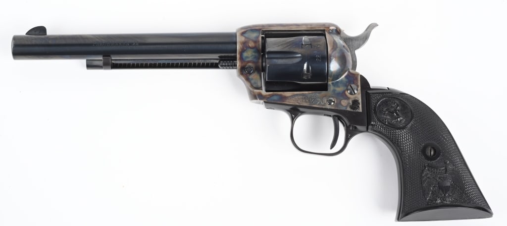 COLT PEACEMAKER .22 S.A. REVOLVER: SERIAL G142976. BARREL 6". CALIBER 22LR. MADE IN 1975. Standard 6-shot single action with blue and case color finish, black eagle grips. Condition. Near new, ghost drag line, no real face burn, near m