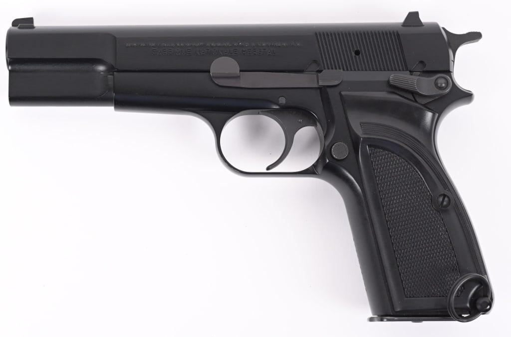1989 COMMERCIAL BROWNING Hi-POWER 9MM LUGER: SERIAL NUMBER: 245PN65108. BARREL: 4-1/2". CALIBER: 9MM LUGER. MANUFACTURED: 1989. Made in Belgium, with a Belgian proof on the left side of the trigger guard. Standard iron sights. Black enamel finis
