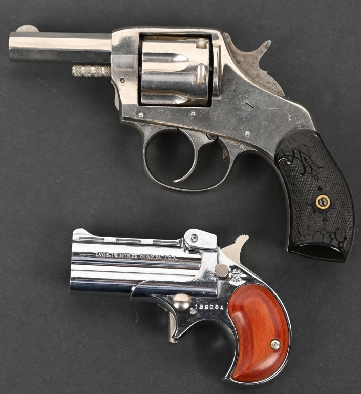 LOT OF 2: H&R THE AMERICAN & DAVIS DERRINGER: 1. SERIAL NUMBER: 36. BARREL: 2-1/2". CALIBER: .32 S&W. MANUFACTURED: 1920S. Harrington & Richardson The American double action revolver. Standard markings on the top of the frame. Octagon barrel with