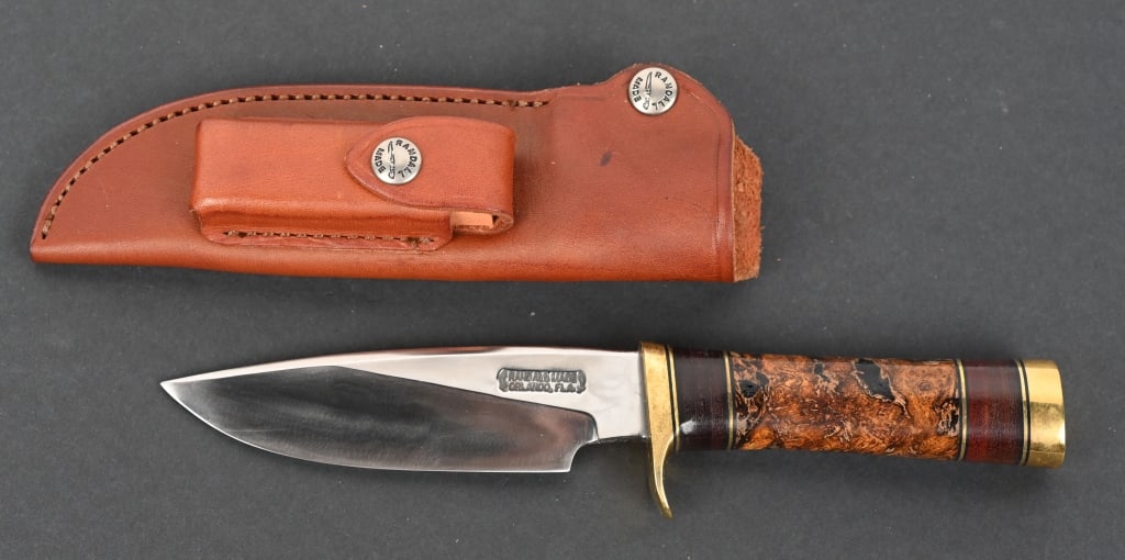 RANDALL MODEL 25 TRAPPER WITH BURLWOOD: Randle 5" carbon steel 1/4" stock Model Trapper with brass single guard with sole leather spacers and Burl Wood handle and brass butt in Randall scabbard CONDITION. Good with blade as new and brass ha