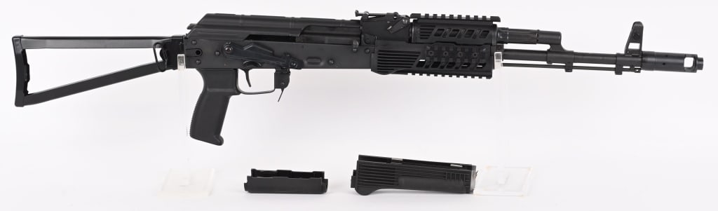 RILEY DEFENSE RAK-74 SEMI AUTO RIFLE 5.45X39: SERIAL NUMBER: C00606. BARREL 16-1/'2". CALIBER: 5.45X39. MANUFACTURED: 2020S. Standard markings and features. Removable AK-74 muzzle break. Standard iron sights. Factory blued finish and folding tria