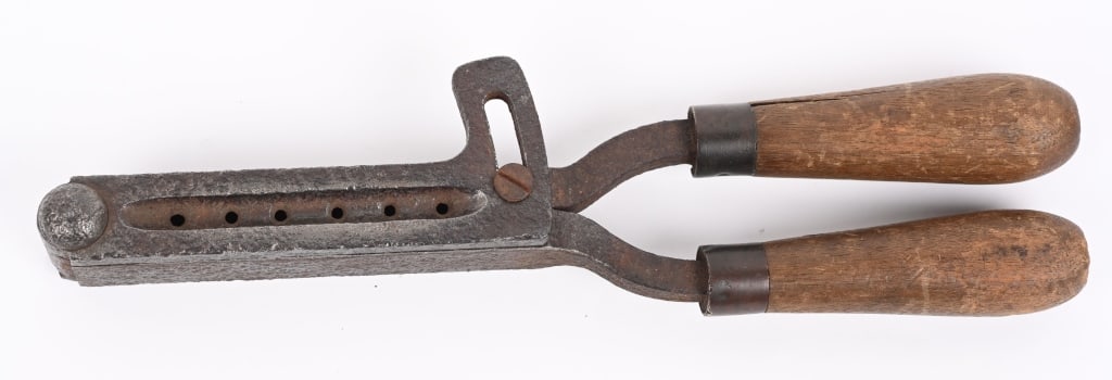 EARLY CAST IRON GANG BULLET MOLD: 6-CAVITY, 44-45 CALIBER. Appears hand forged with wood handles, hand made possibly Confederate. Measures 12" in length. No maker stamps of any kind.