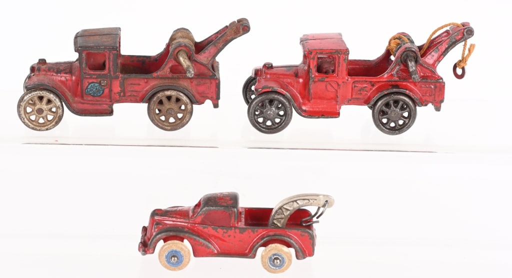 3- ARCADE CAST IRON TOW TRUCKS (1 of 2)