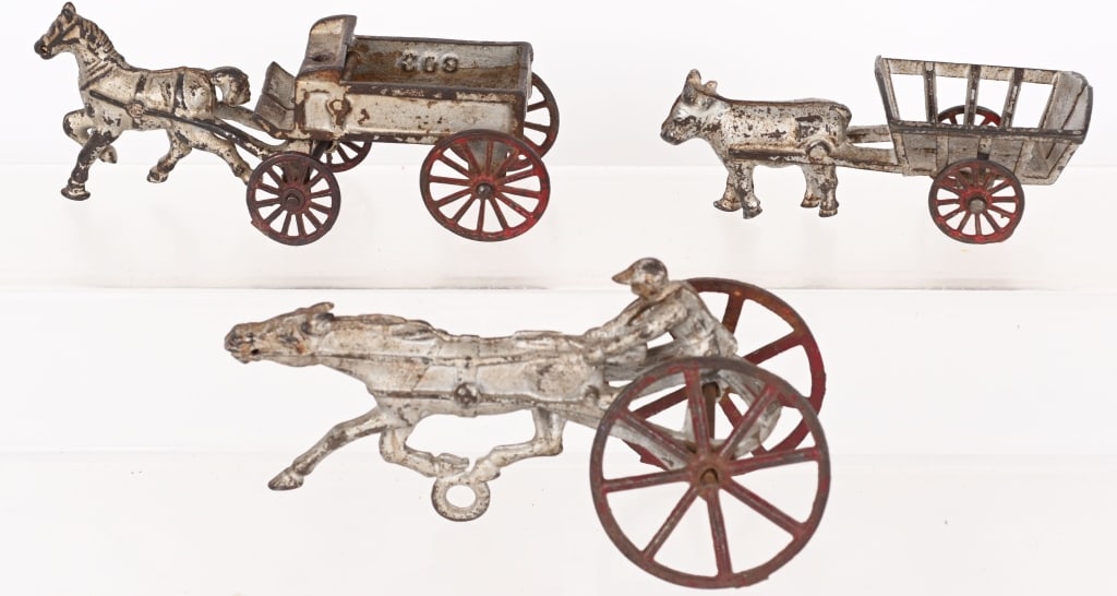 3- CAST IRON ANIMAL DRAWN WAGONS (1 of 2)