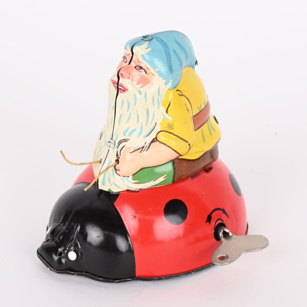 TIN WINDUP GNOME ON LADY BUG (1 of 4)