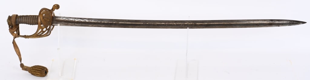 ORNATE FEDERAL CIVIL WAR OFFCIERS SWORD W KNOT: Civil War Officers Sword with European manufacturing stamps with a 30 1/2 inch highly polished, slightly curved blade with a single fuller. The etchings on the blade are standard battle motifs and cre