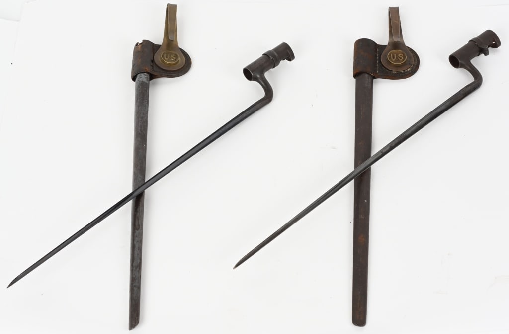 M1873 TRAPDOOR SPRINGFIELD SOCKET BAYONET LOT OF 2: Lot of two Trapdoor Bayonets with leather frogs and brass US swivel, US Marked 20" socket bayonet for the Trapdoor Springfield rifle. In very good condition with minimal loss of finish at the muzzle r