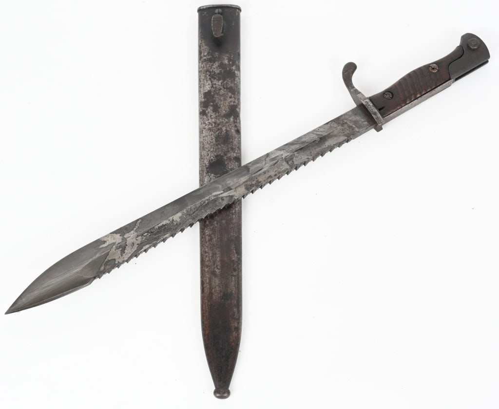 WWI IMPERIAL GERMAN BUTCHER SAW TOOTH BAYONET WW1: Bayonet marked " J.H. Becker Solingen. Bayonet is 20.375" overall with a 14.625" blade. Wood grips show typical wear and tear. Blade shows graying with light?pitting. Stud release is frozen and one sc