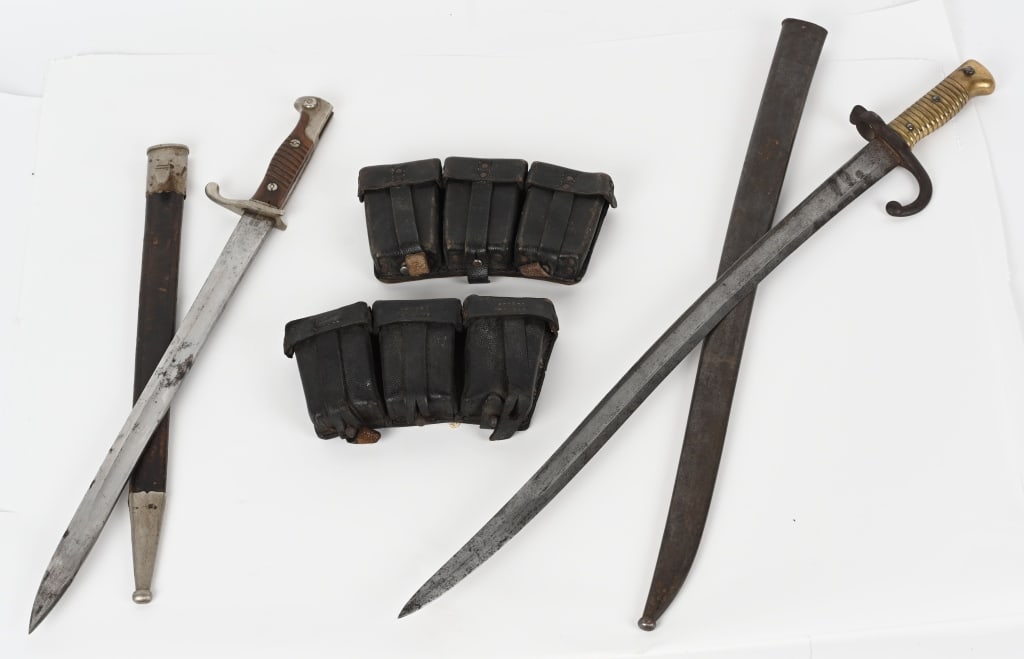 WW1 PERIOD GERMAN & FRENCH BAYONET LOT WWI: Lot of two WWI period bayonets to include 1) Imperial German Dress Bayonet by WKC with original leather body scabbard with nickeled steel fittings measuring 22 1/4 in the scabbard with a 16 1/4 inch s