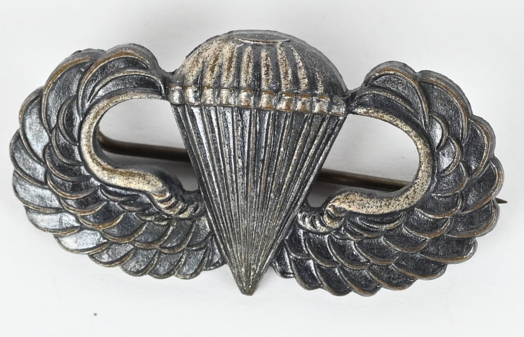 WWII US ARMY PARATROOPER BADGE BY J.R. GAUNT WW2: WWII U.S. Army Paratrooper Wings. Winged parachute measures approximately 38mm x 2cm. Complete with original "C" hinge, pin and catch assembly. Marked J.R. Gaunt in excellent condition.?The D-Day inva