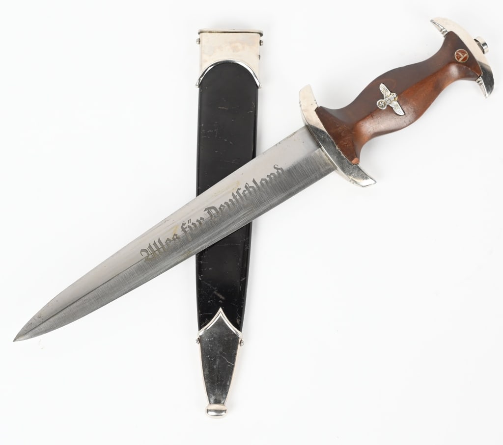 WWII NAZI GERMAN NSKK DAGGER BY M7/81/39 WW2: Roughly, 22cm long, double edged, nickel/silver plated, drop forged steel construction blade with a low central ridge. The blade shows the expected scabbard runner marks with most of the original cros