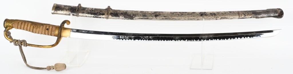 RUSSO JAPANESE KYU GUNTO SWORD: Katana has parade blade with 26" cutting edge. Brass tsuka has family kamon on spine. Ray skin grip with braided brass wire. Has very nice bullion sword knot. Nickel finish is worn on saya. Very Good